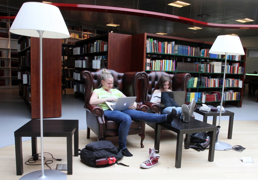Two students writing a project together at Hjørring library.  Photo by: Per Drustrup Larsen